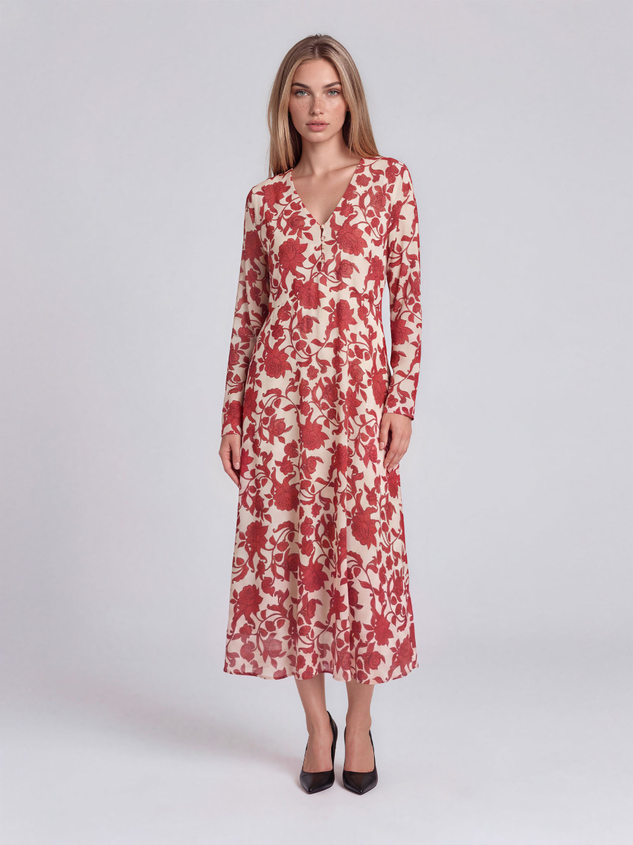 Floral dress with long sleeves and a gathered waist.