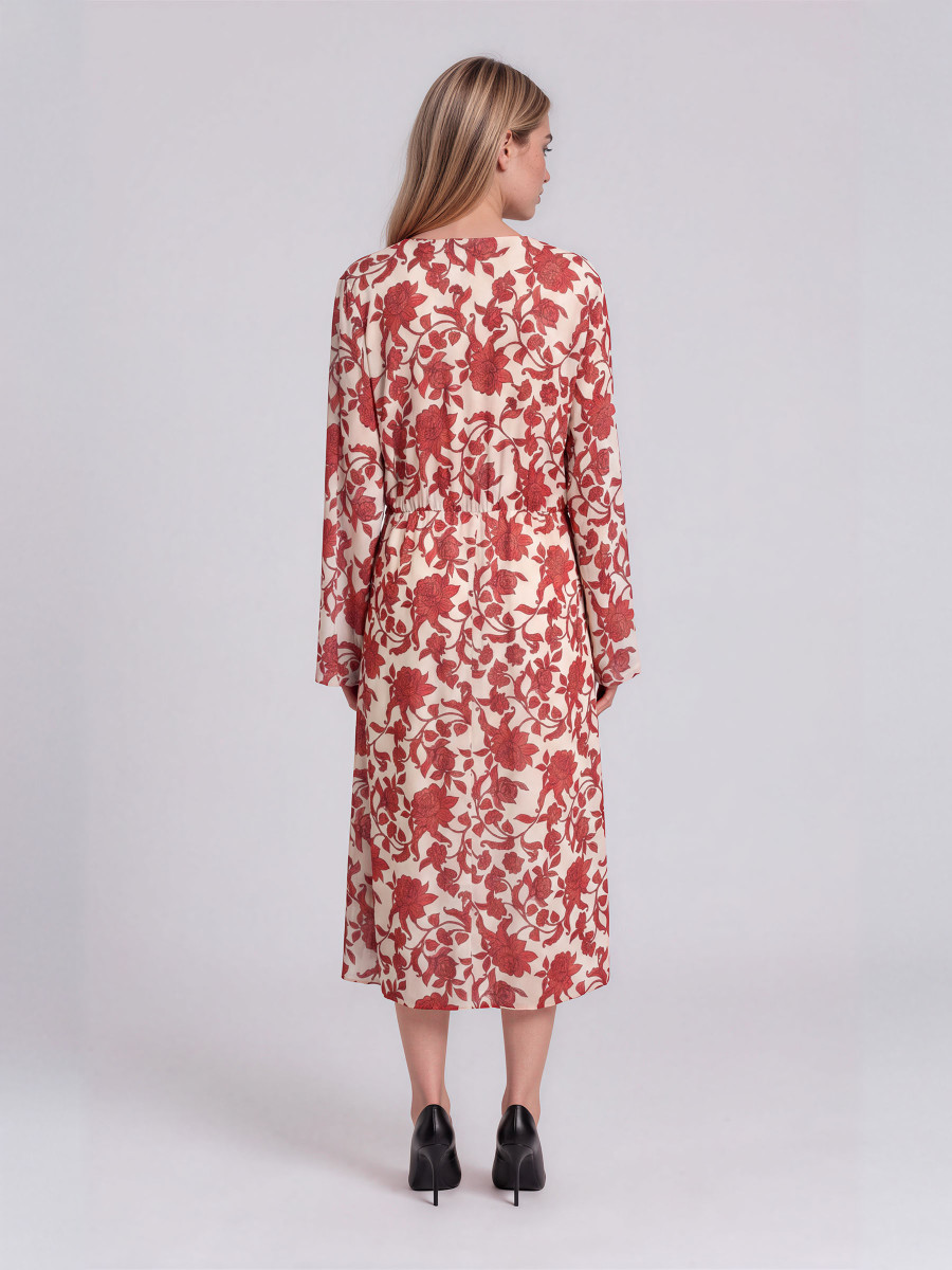 Floral dress with long sleeves and a gathered waist.