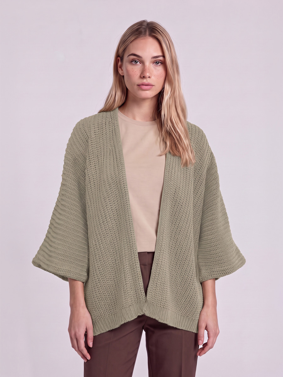 Oversized knitted cardigan with long sleeves.