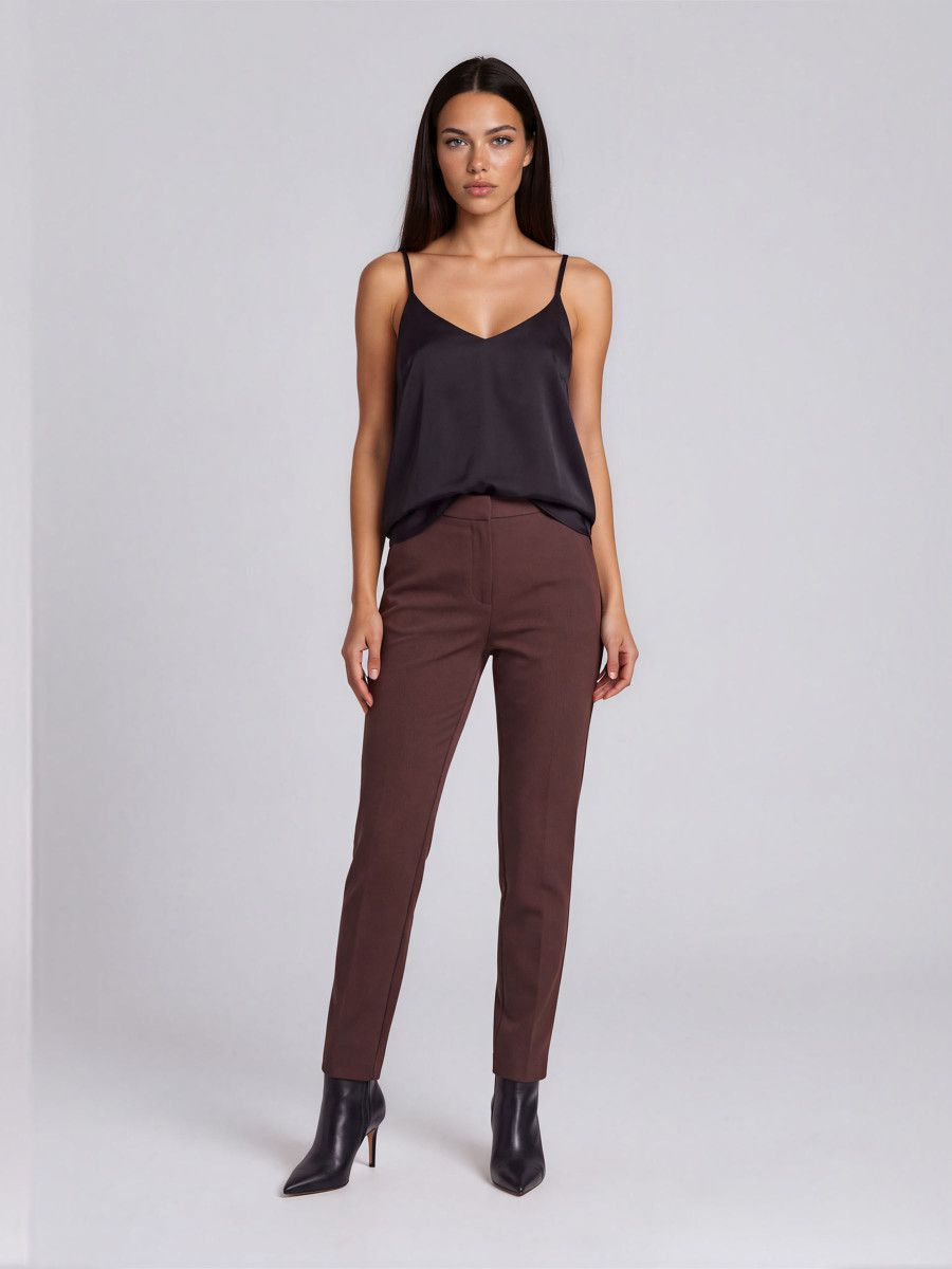 Trousers with pleat detail near the pocket