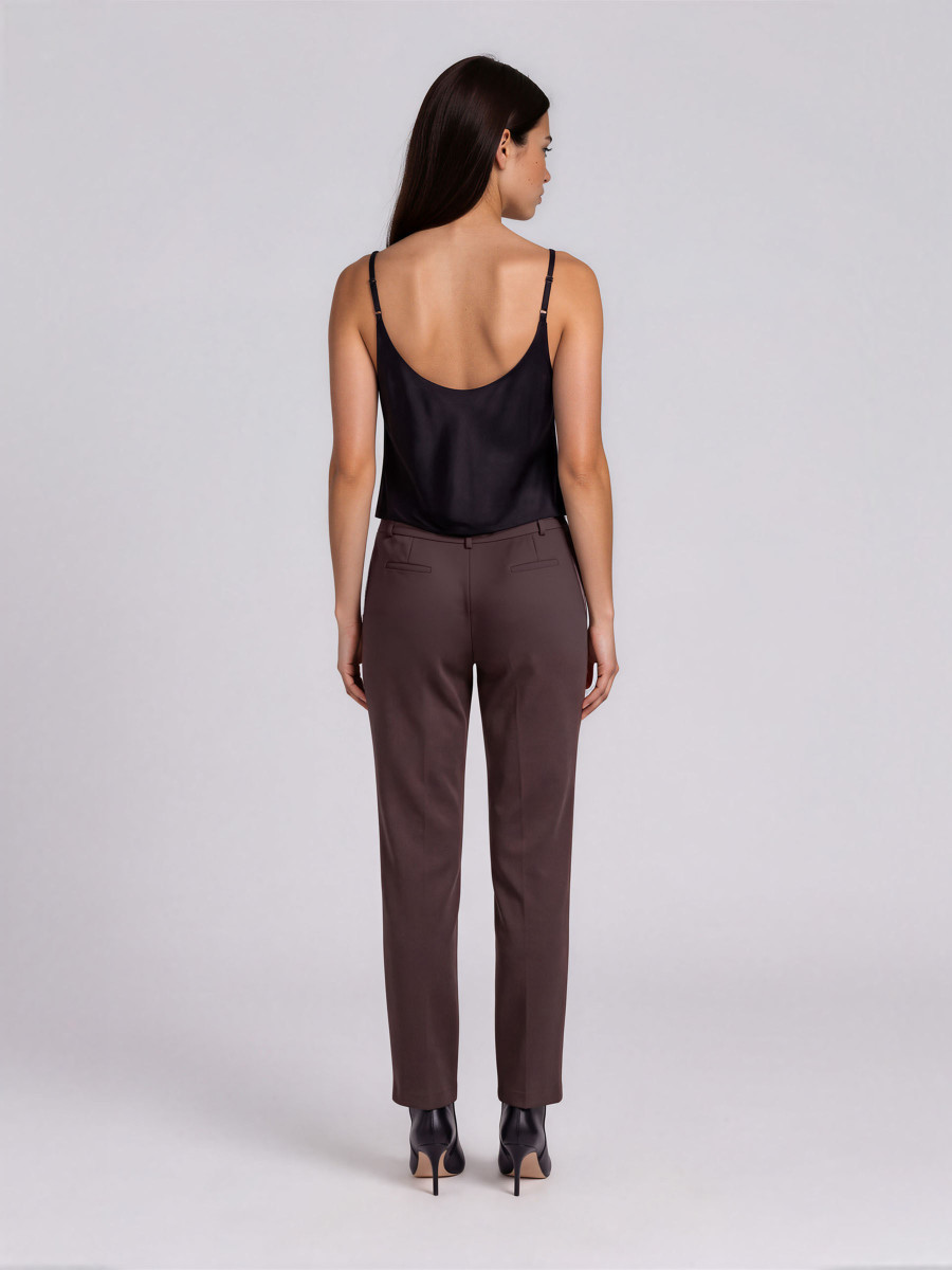 Trousers with pleat detail near the pocket