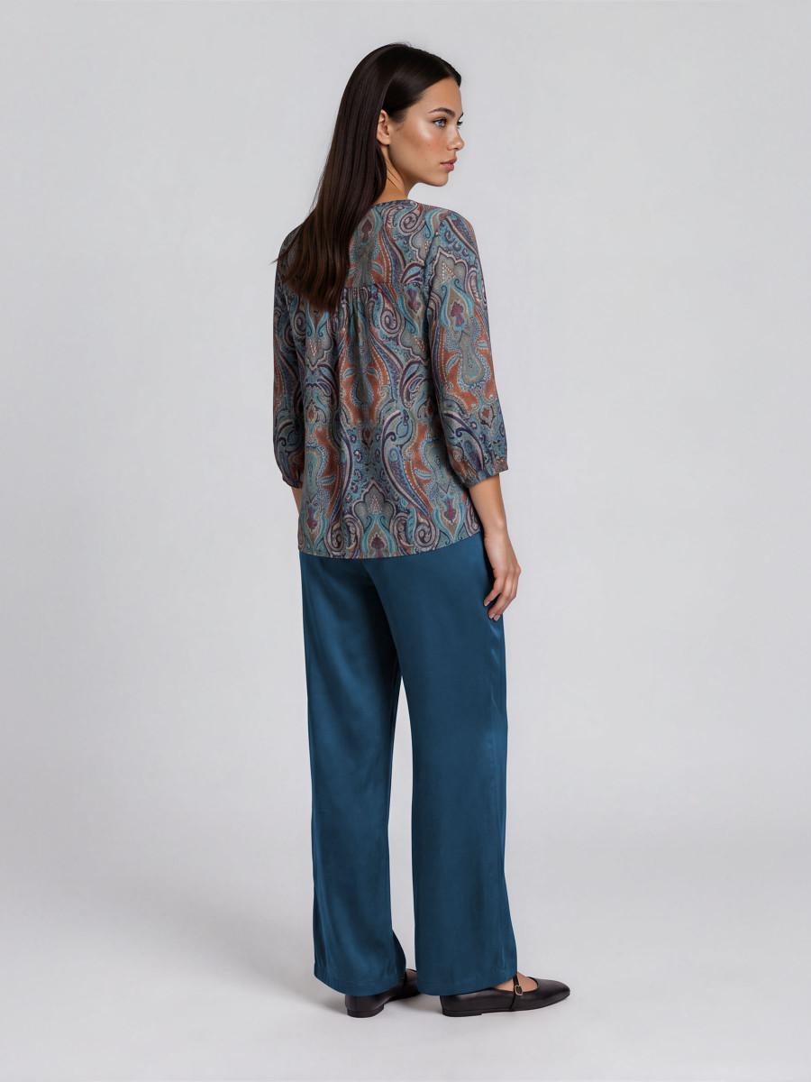 Wide-leg pants with an elasticated back waistband and a tailored flat front