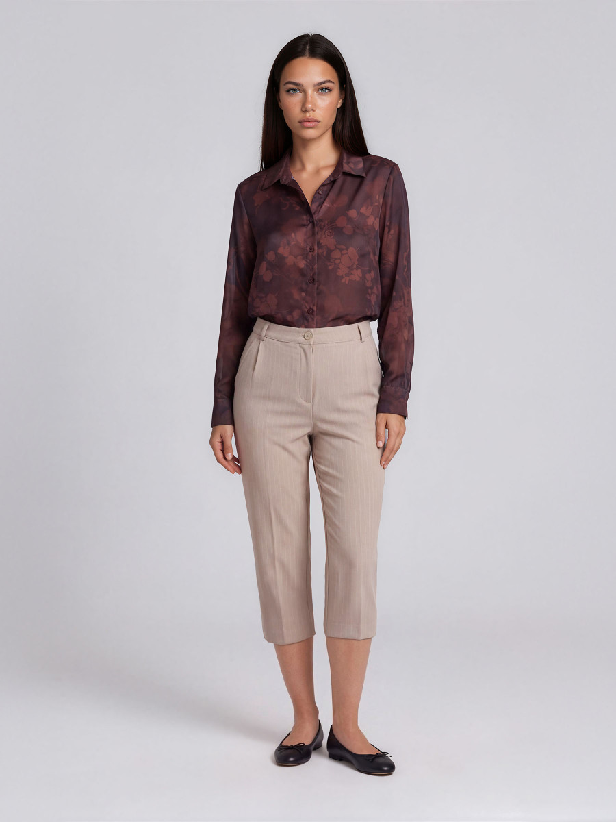 Trousers with pleat detail near the pocket