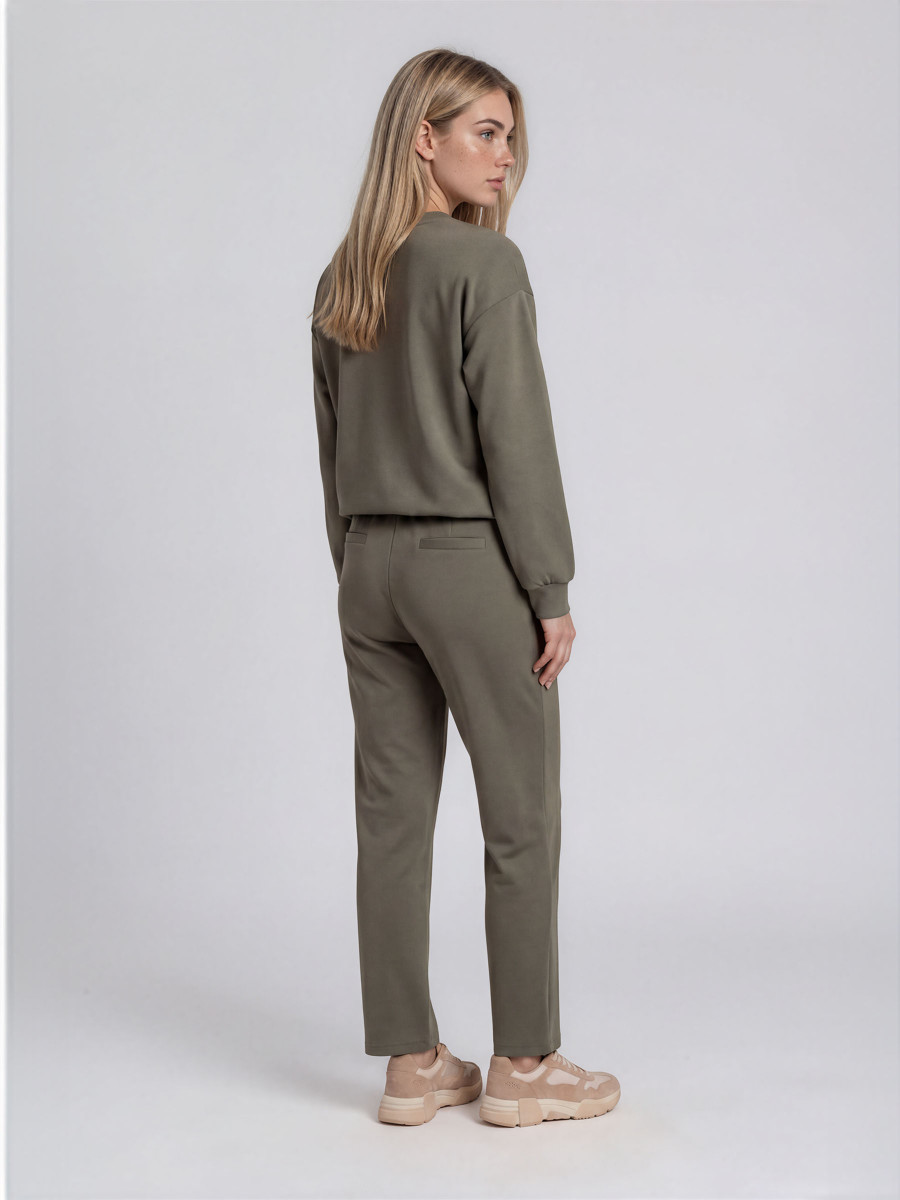 Pants with front pockets elastic waistband and a decorative drawstring and buttons